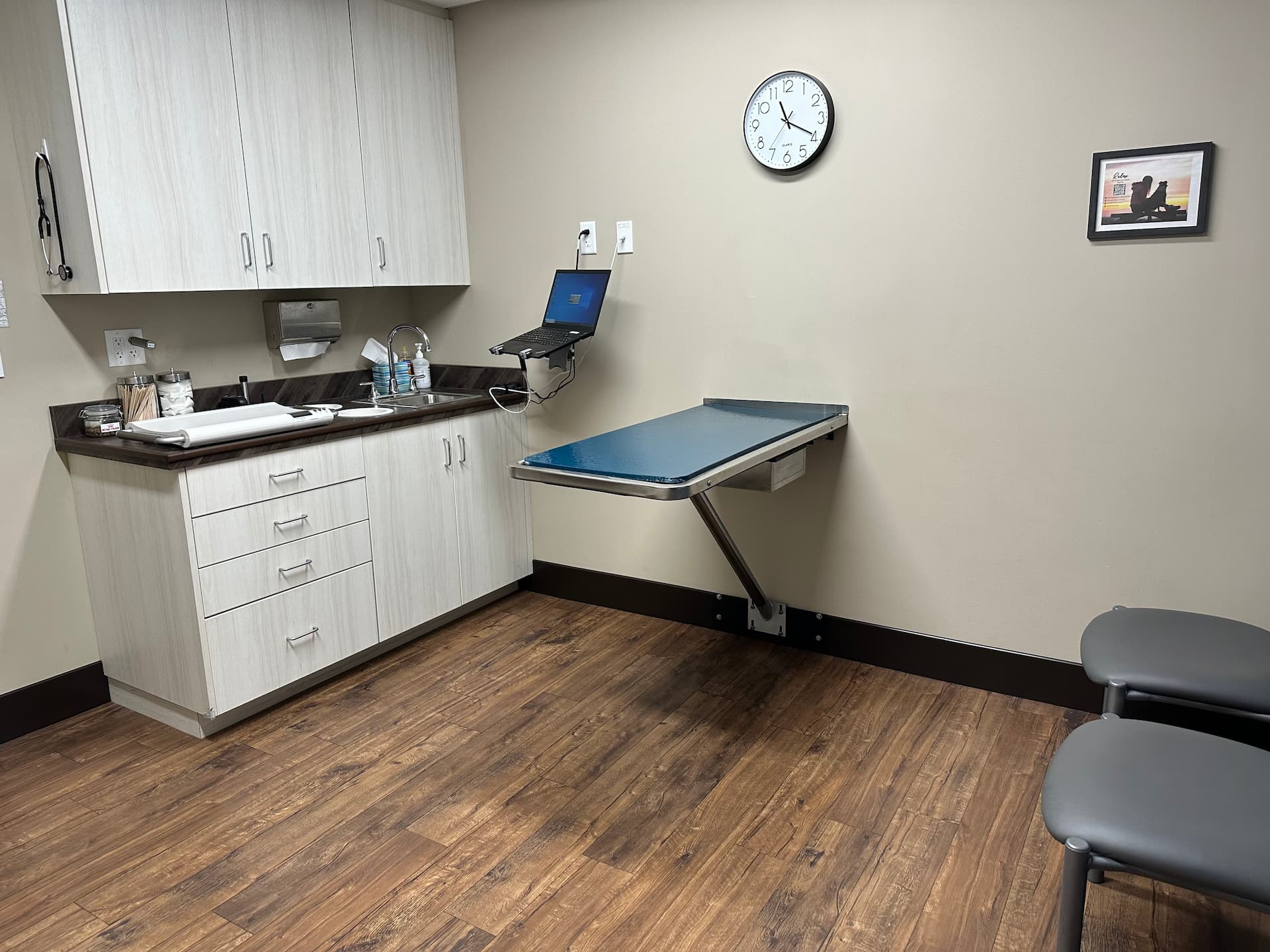 Exam Room A room with a table and chairs.
